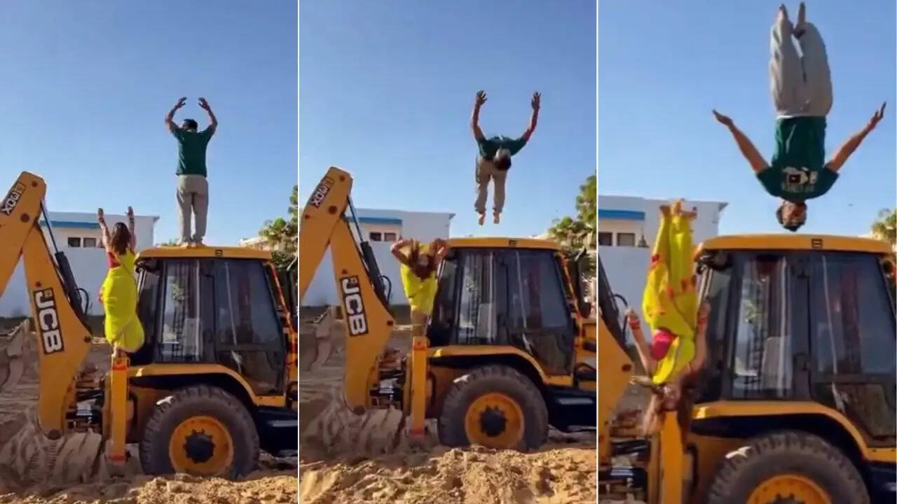 Couple Stunt On Bulldozer