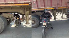स्टंट या पागलपन? शख्स ने खड़ी ट्रक के नीचे से निकाली बाइक, बोला - 'मैं कलाकार हूं!', इंटरनेट यूजर्स का फूटा गुस्सा