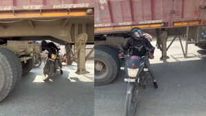 स्टंट या पागलपन? शख्स ने खड़ी ट्रक के नीचे से निकाली बाइक, बोला - 'मैं कलाकार हूं!', इंटरनेट यूजर्स का फूटा गुस्सा