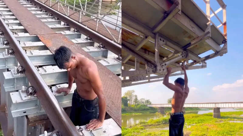 रेलवे ट्रैक पर खतरनाक स्टंट करता लड़का