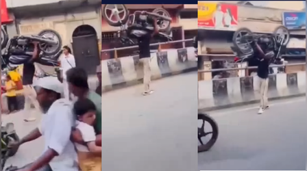 बीच सड़क बाहुबली बना शख्स, कंधे पर बाइक को उठाकर काटा गदर, देखें शॉकिंग Video