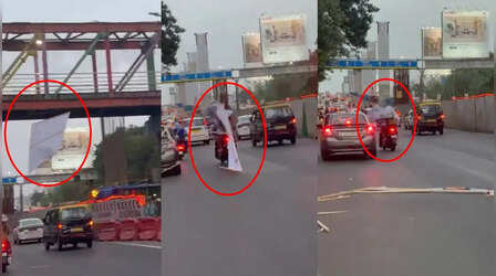 Thane News: ईस्टर्न एक्सप्रेस हाइवे पर चलती बाइक के ऊपर गिरा बड़ा सा बैनर, बाल-बाल बची महिला सवार